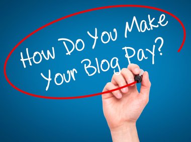 Man Hand writing How Do You Make Your Blog Pay? with black marke