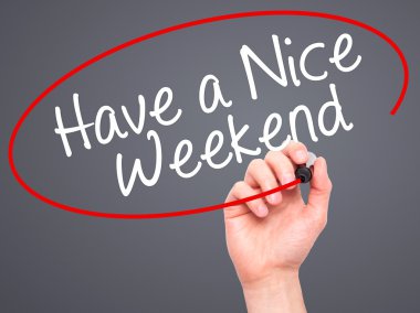 Man Hand writing Have a Nice Weekend  with black marker on visua