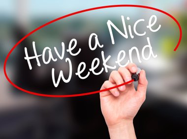Man Hand writing Have a Nice Weekend  with black marker on visua