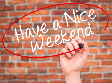 Man Hand writing Have a Nice Weekend  with black marker on visua
