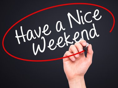 Man Hand writing Have a Nice Weekend  with black marker on visua