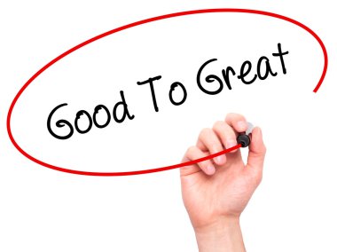 Adam el iyi için büyük siyah kalemi ile görsel dağ eteğindeki taş yığını üzerinde yazma