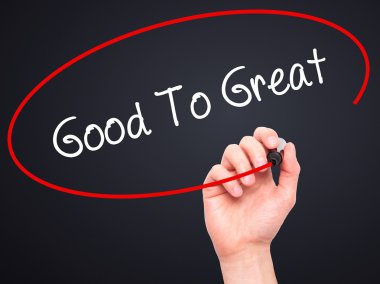 Adam el iyi için büyük siyah kalemi ile görsel dağ eteğindeki taş yığını üzerinde yazma