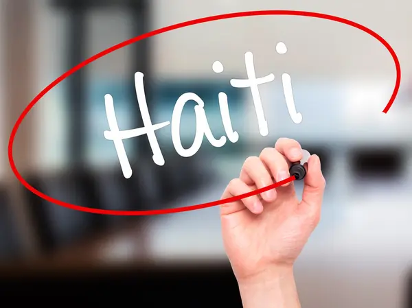 Man Hand writing Haiti with black marker on visual screen — Stock Photo, Image