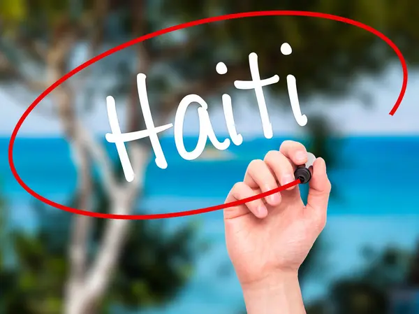 Man Hand writing Haiti with black marker on visual screen — Stock Photo, Image