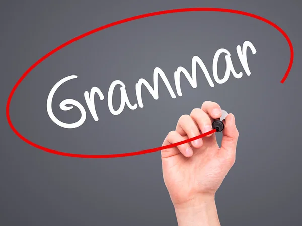 Man Hand writing Grammar with black marker on visual screen — Stock Photo, Image