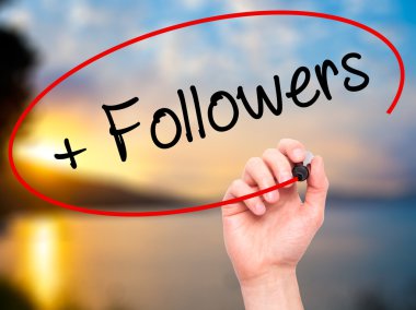 Man Hand writing + Followers with black marker on visual screen