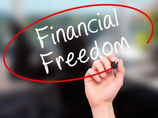 Man Hand writing Financial Freedom with black marker on visual s — Stock Photo, Image