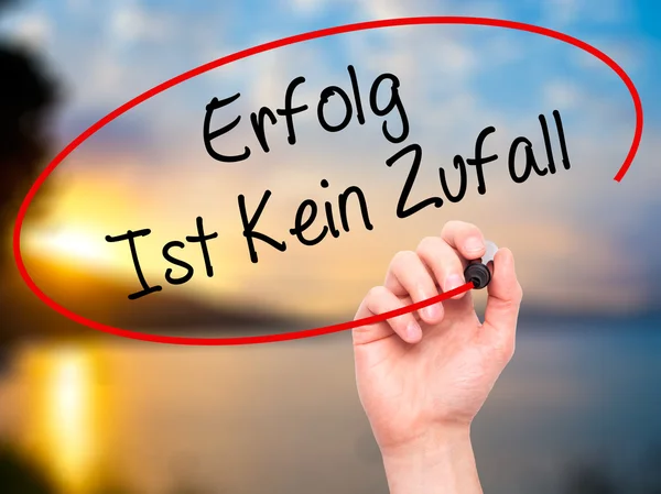 Man Hand writing Erfolg Ist Kein Zaufall (Success Is No Accident