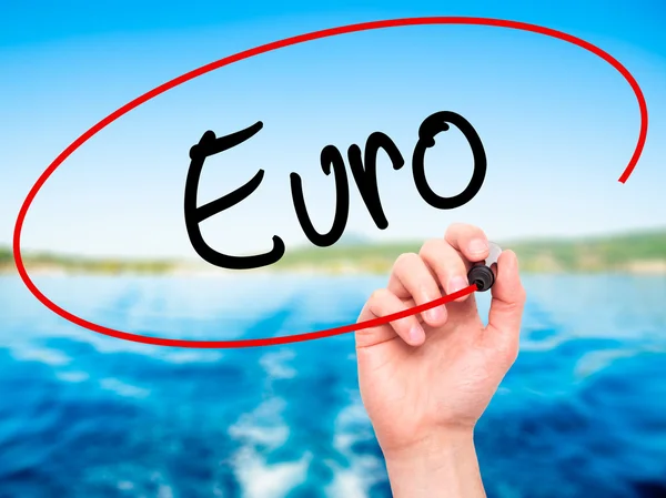 Man Hand writing Euro with black marker on visual screen — Stock Photo, Image