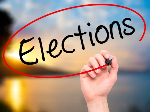 Man Hand writing Elections with black marker on visual screen — Stock Photo, Image