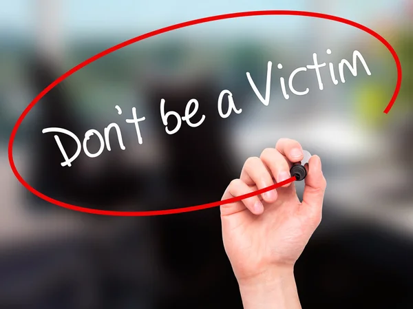Man Hand writing Don't be a Victim  with black marker on visual — Stock Photo, Image