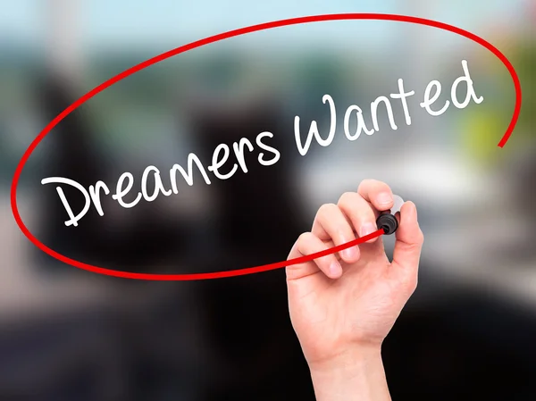 Man Hand writing Dreamers Wanted  with black marker on visual sc — Stock Photo, Image
