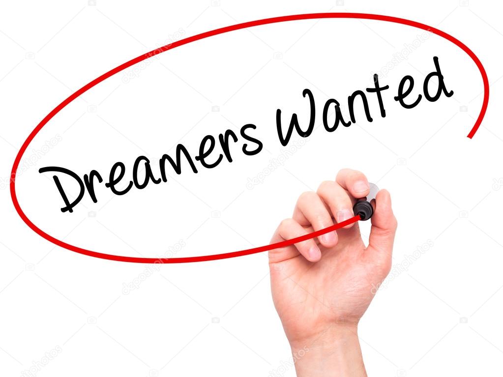 Man Hand writing Dreamers Wanted  with black marker on visual sc