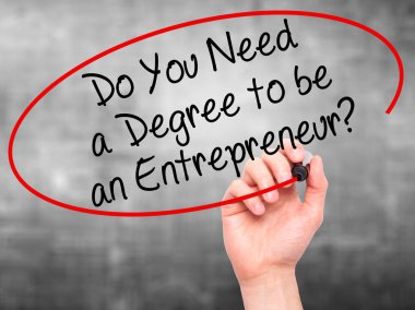 Man Hand writing Do You Need a Degree to be an Entrepreneur? wit
