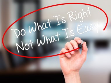 Man Hand writing Do What Is Right Not What Is Easy with black ma