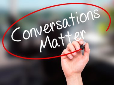 Man Hand writing Conversations Matter with black marker on visua