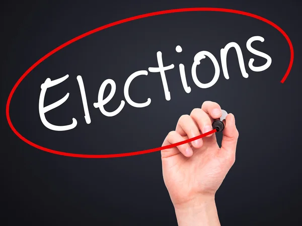 Man Hand writing Elections with black marker on visual screen — Stock Photo, Image