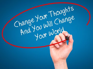 Man Hand writing Change Your Thoughts And You Will Change Your W