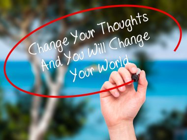 Man Hand writing Change Your Thoughts And You Will Change Your W