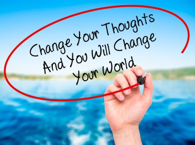 Man Hand writing Change Your Thoughts And You Will Change Your W