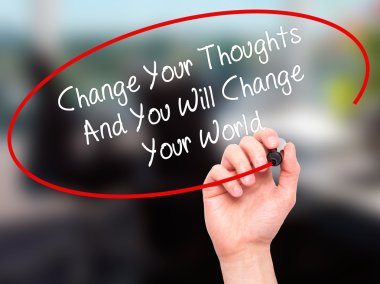 Man Hand writing Change Your Thoughts And You Will Change Your W