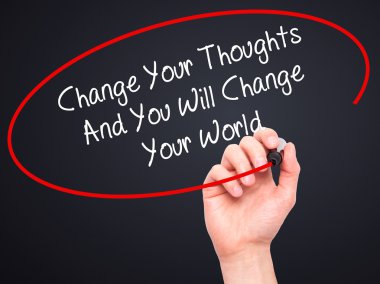 Man Hand writing Change Your Thoughts And You Will Change Your W