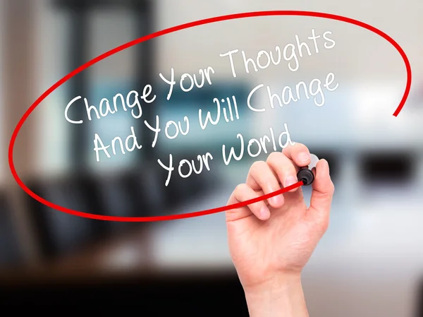 Man Hand writing Change Your Thoughts And You Will Change Your W