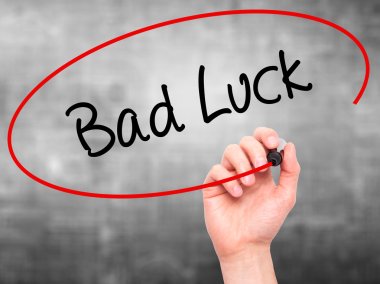 Man Hand writing Bad Luck with black marker on visual screen clipart