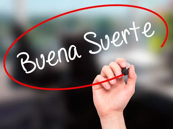 Man Hand writing Buena Suerte (Boa Sorte em Espanhol) com preto — Fotografia de Stock
