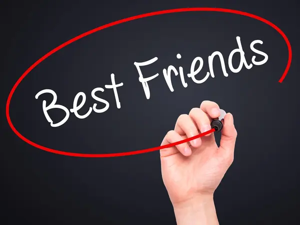 Man Hand writing Best Friends with black marker on visual screen — Stock Photo, Image