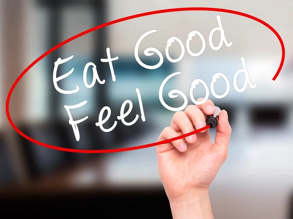 Man Hand writing Eat Good Feel Good with black marker on visual — Stock Photo, Image