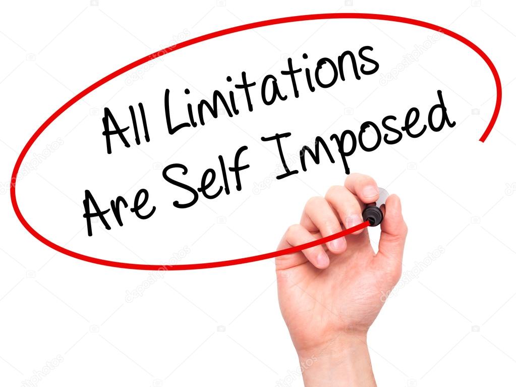 Man Hand writing All Limitations Are Self Imposed with black mar