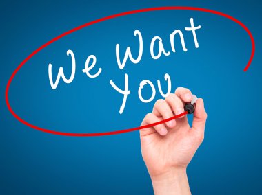 Man Hand writing We Want You with black marker on visual screen