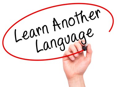 Man Hand writing Learn Another Language with black marker on vis