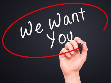 Man Hand writing We Want You with black marker on visual screen