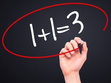 Man Hand writing 1 plus1 is 3 with black marker on visual screen