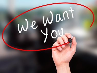 Man Hand writing We Want You with black marker on visual screen