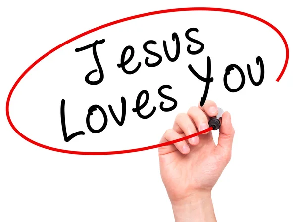 Man Hand skriver Jesus älskar dig med svart markering på visuella scr — Stockfoto