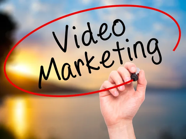 Man Hand writing Video Marketing with black marker on visual scr — Stock Photo, Image
