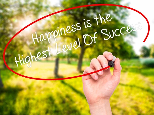 Man Hand writing Happiness is the Highest Level Of Success with — Stock Photo, Image