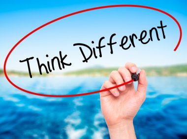 Man Hand writing Think Different with black marker on visual scr