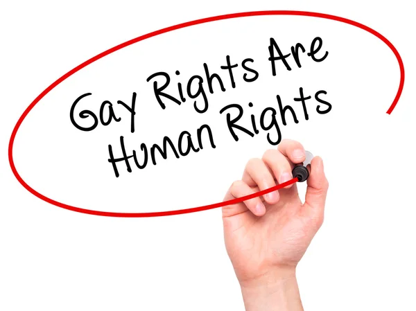 Man Hand writing Gay Rights Are Human Rights  with black marker — Zdjęcie stockowe