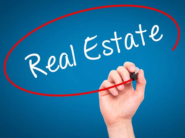 Man Hand writing Real Estate  with black marker on visual screen — Stock Photo, Image