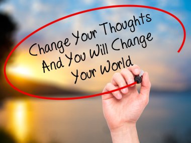 Man Hand writing Change Your Thoughts And You Will Change Your W