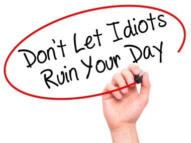 Man Hand writing Don't Let Idiots Ruin Your Day with black marke clipart