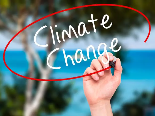 Man Hand writing Climate Change with black marker on visual scre — Stock Photo, Image