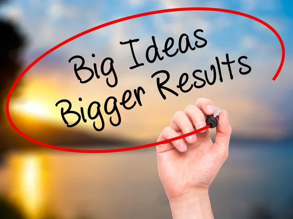 Man Hand writing Big Ideas Bigger Results  with black marker on — Stock Photo, Image