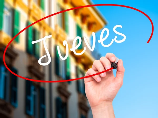 Man Hand writing Jueves (quinta-feira em espanhol) com marcador preto — Fotografia de Stock