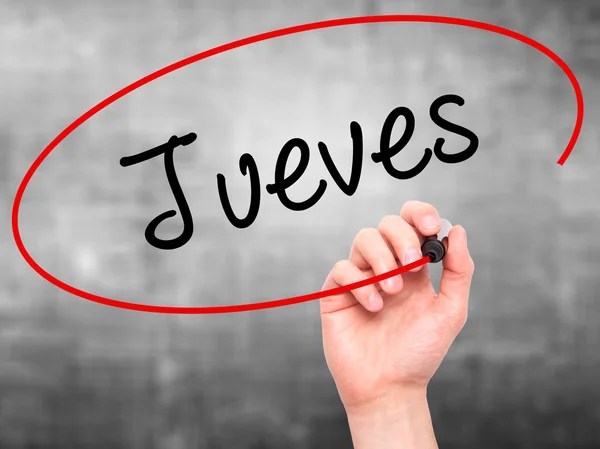 Людина почерком Jueves (четвер по-іспанськи) з чорний маркер — стокове фото